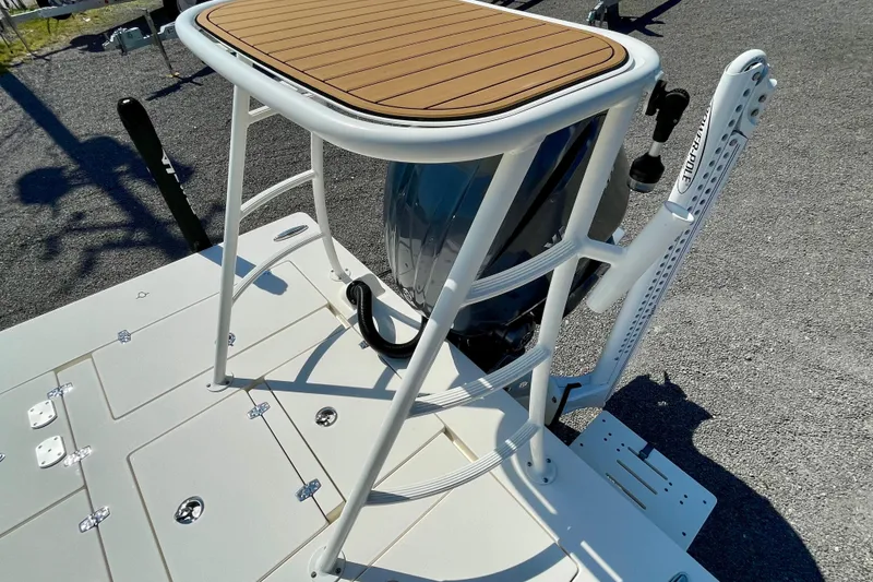 Slide: The Image of 2022 Hewes Redfisher 21 boat with elevated platform and outboard motor. - 21