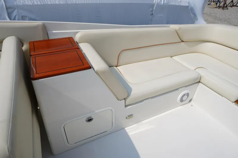 Slide: The Image of 2007 Chris-Craft Corsair 28 interior with cream leather seating and wooden accents. - 11