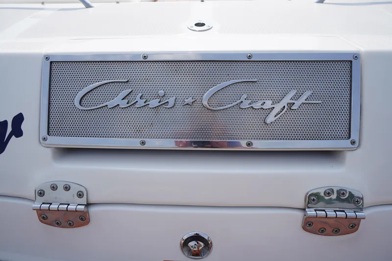 Slide: The Image of 2007 Chris-Craft Corsair 28 boat emblem with chrome detailing. - 21