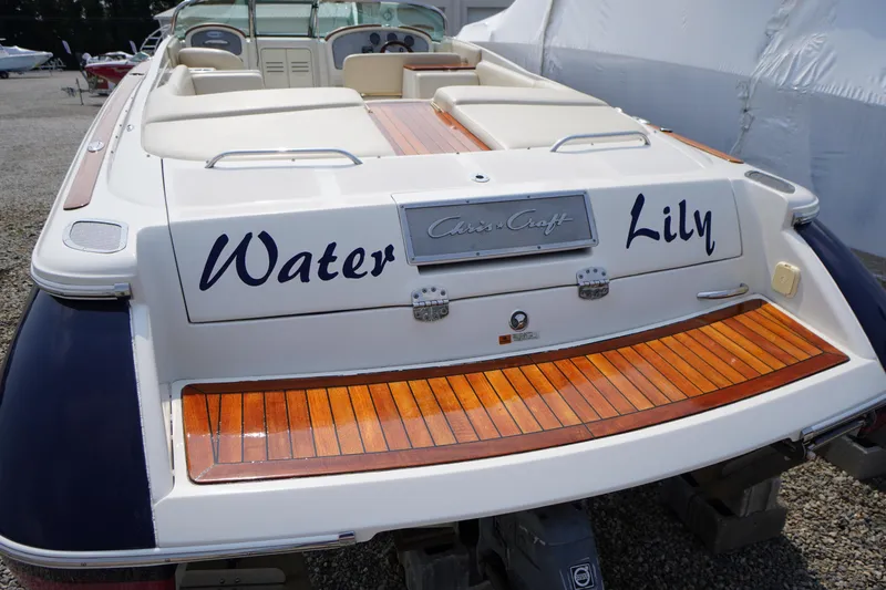 Slide: The Image of Interior cabin of 2007 Chris-Craft Corsair 28 with plaid cushions and storage. - 25