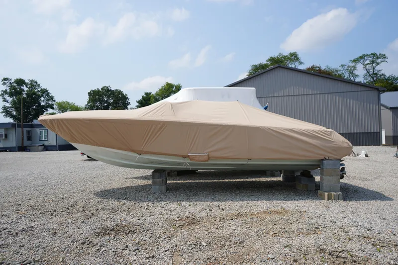Slide: The Image of Interior of a 2007 Chris-Craft Corsair 28 boat, featuring elegant seating and dashboard. - 28