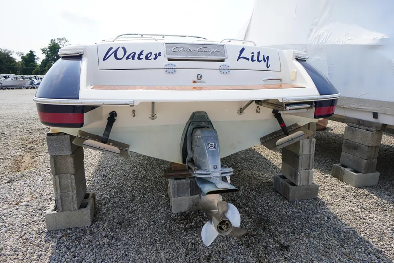 Slide: The Image of 2007 Chris-Craft Corsair 28 boat named "Water Lily" on blocks, rear view. - 33