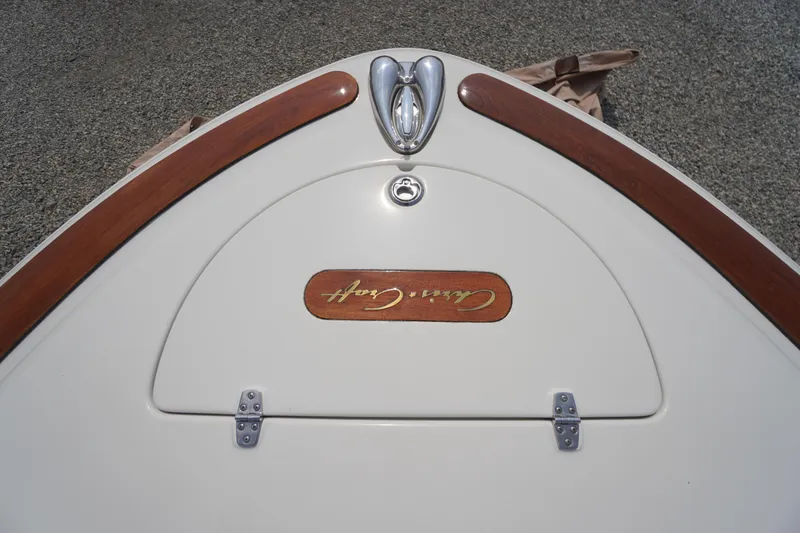Slide: The Image of 2007 Chris-Craft Corsair 28 boat deck with wood accents and logo detail. - 7