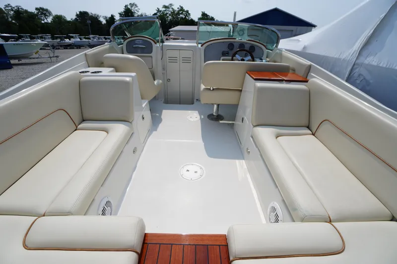 Slide: The Image of 2007 Chris-Craft Corsair 28 boat interior with luxurious seating and elegant design. - 9