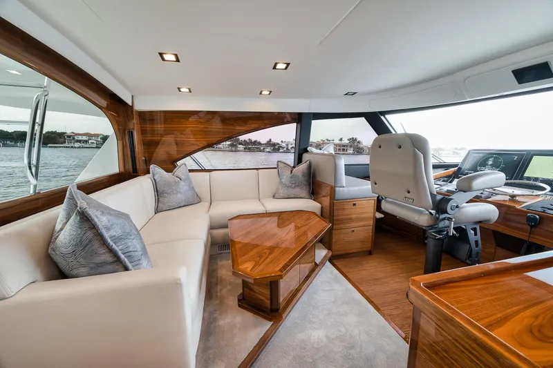 Slide: The Image of Luxurious interior of 2024 Viking 72 Skybridge yacht with plush seating and elegant wood finishes. - 29