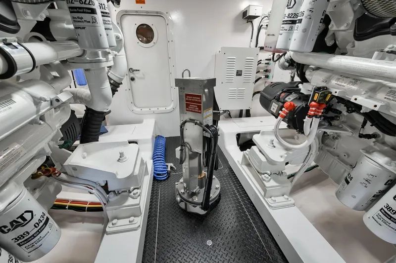 Slide: The Image of Engine room of 2024 Viking 72 Skybridge yacht, showcasing advanced machinery and equipment. - 4