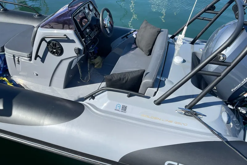 Slide: The Image of 2017 Grand Goldenline 500 boat interior with steering console and seating. - 20