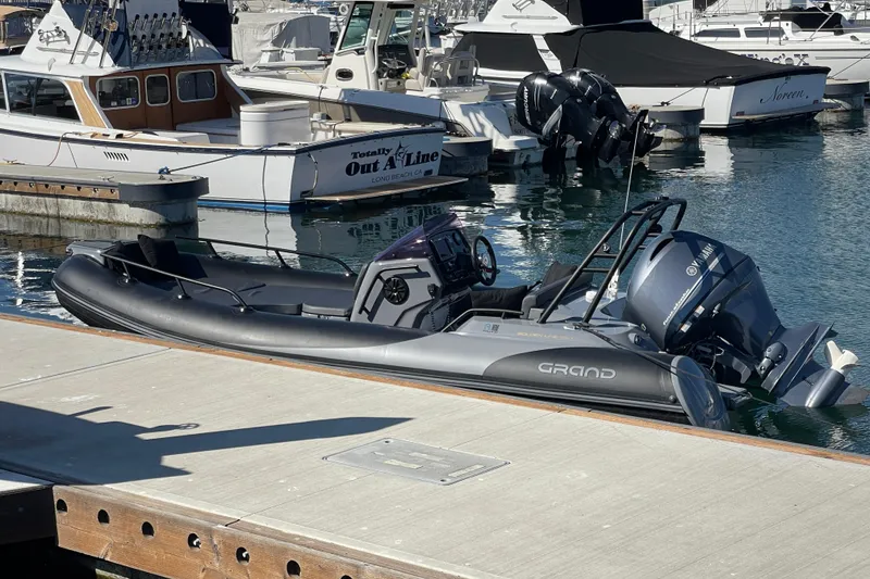 Slide: The Image of 2017 Grand Goldenline 500 boat docked at marina, featuring Yamaha outboard motor. - 21