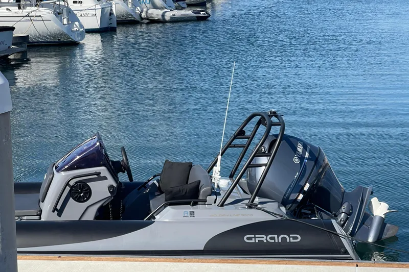 Slide: The Image of 2017 Grand Goldenline 500 boat docked in a marina, featuring a Yamaha outboard motor. - 22