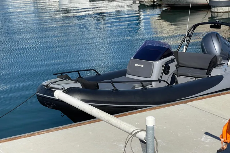 Slide: The Image of 2017 Grand Goldenline 500 boat docked at a marina on calm water. - 23