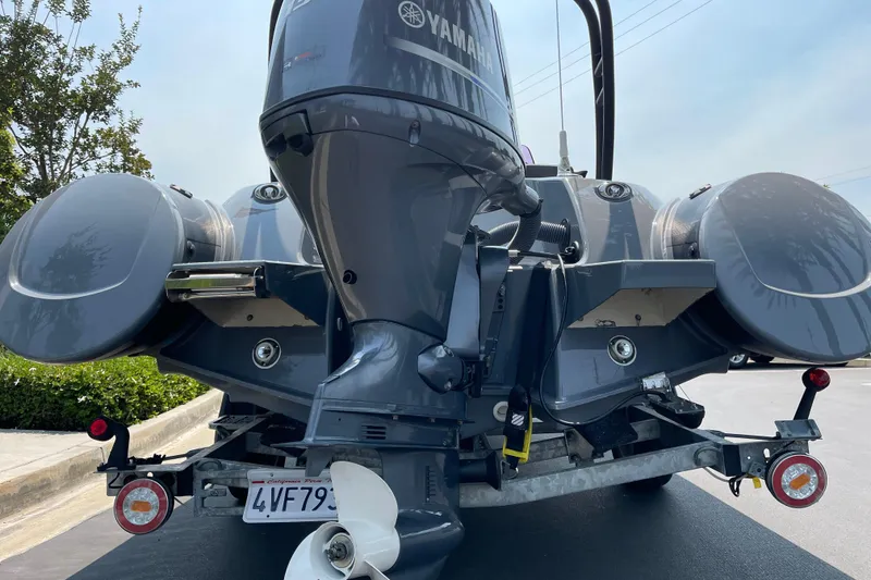Slide: The Image of Rear view of a 2017 Grand Goldenline 500 boat with Yamaha outboard motor and Lumitex RGBW underwater lights. - 3