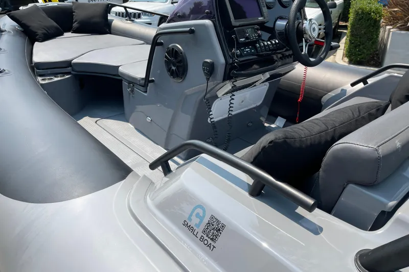 Slide: The Image of 2017 Grand Goldenline 500 boat interior with steering console and seating area. - 6