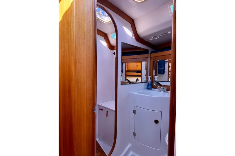 Slide: The Image of Interior of 1991 J/Boats yacht bathroom with wooden accents and modern fixtures. - 17