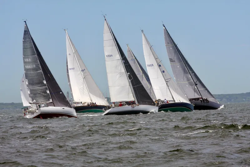 Slide: The Image of Sailboats racing on open water, featuring J/Boats models from 1991. - 3
