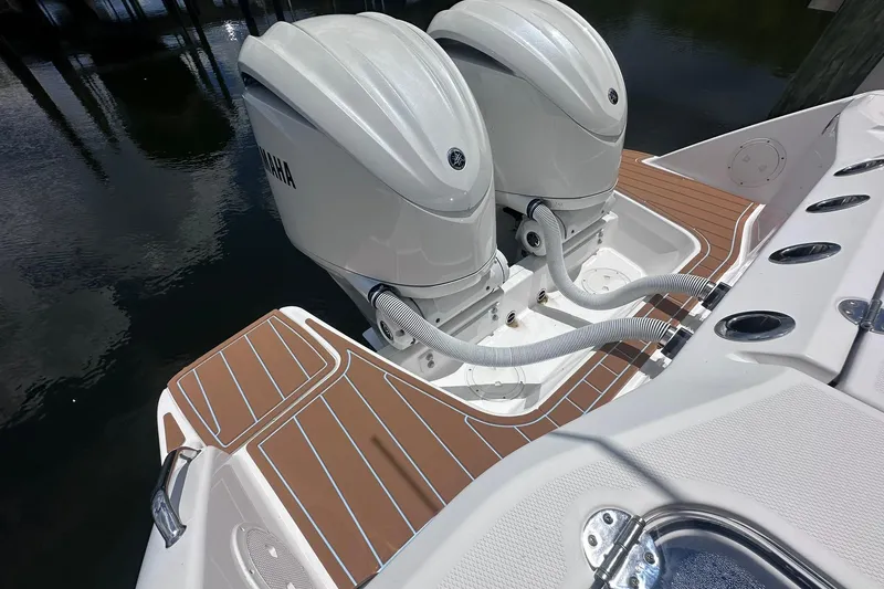 Slide: The Image of 2023 Everglades 285 Center Console boat with twin Yamaha outboard engines. - 11