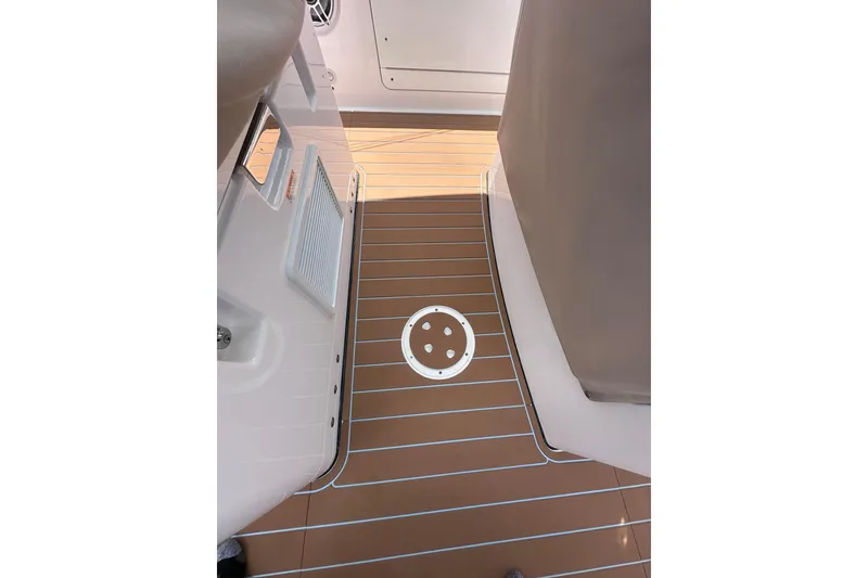 Slide: The Image of 2023 Everglades 285 Center Console boat deck with sleek design and modern features. - 18