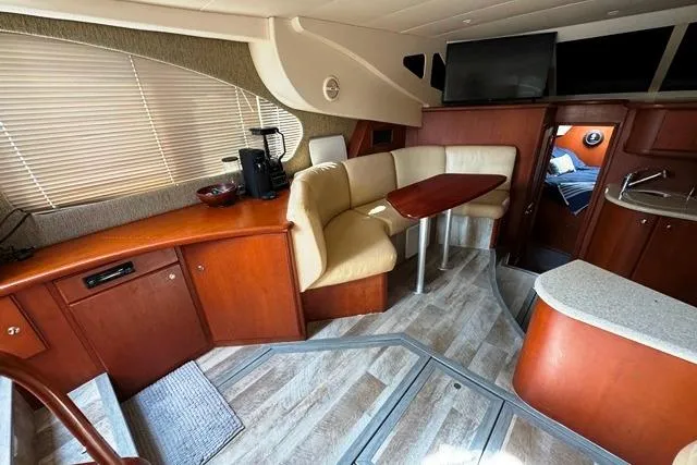 Slide: The Image of 2004 Silverton 35 MY Aft Cabin Motoryacht interior with cozy seating and modern amenities. - 11