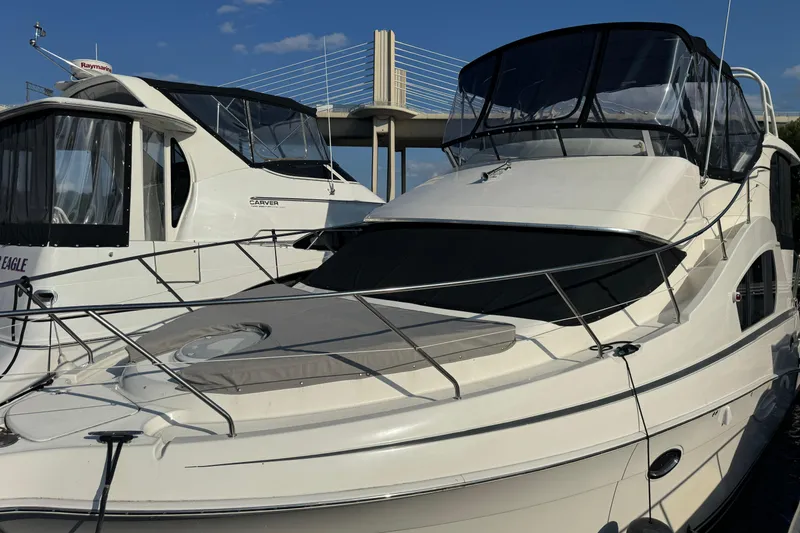 Slide: The Image of 2004 Silverton 35 MY Aft Cabin Motoryacht docked beside another yacht. - 16