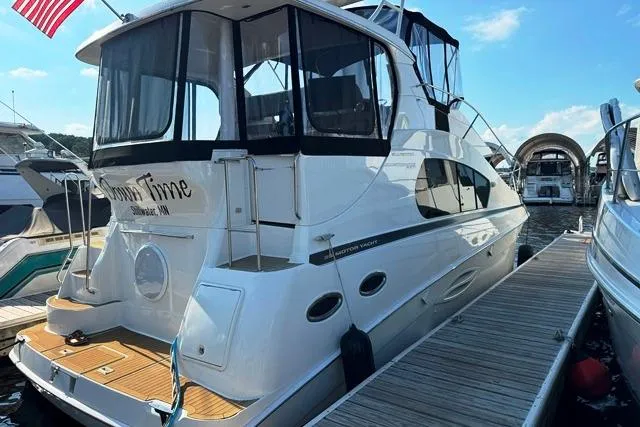 Slide: The Image of 2004 Silverton 35 MY Aft Cabin Motoryacht docked at marina. - 21