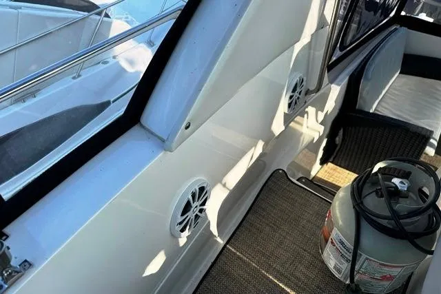 Slide: The Image of 2004 Silverton 35 MY Aft Cabin Motoryacht interior with seating and propane tank. - 26