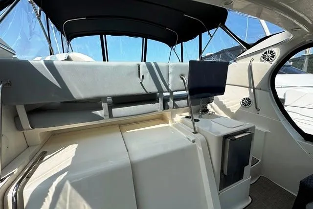 Slide: The Image of 2004 Silverton 35 MY Aft Cabin Motoryacht interior with seating and helm station. - 29