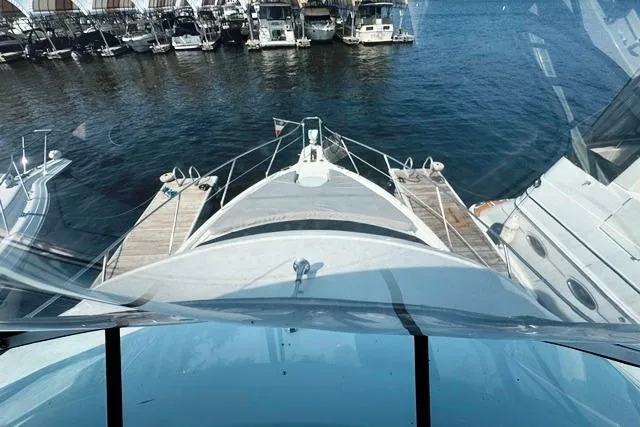 Slide: The Image of 2004 Silverton 35 MY Aft Cabin Motoryacht docked at marina, viewed from helm. - 33