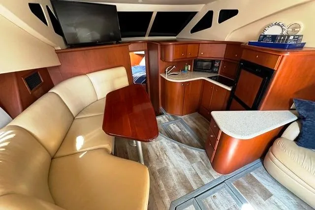 Slide: The Image of 2004 Silverton 35 MY Aft Cabin Motoryacht interior with kitchen and seating area. - 37