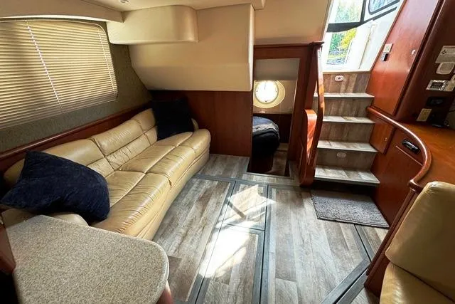 Slide: The Image of 2004 Silverton 35 MY Aft Cabin Motoryacht interior with beige leather seating and wood accents. - 38