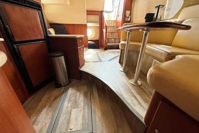 Slide: The Image of Interior of 2004 Silverton 35 MY Aft Cabin Motoryacht with wood flooring and seating area. - 42