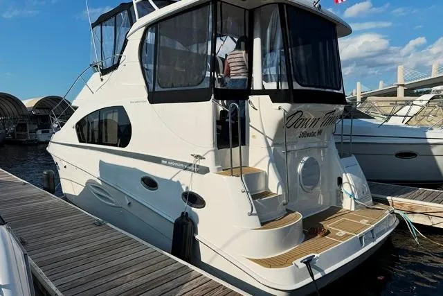 Slide: The Image of 2004 Silverton 35 MY Aft Cabin Motoryacht docked at marina under blue sky. - 43