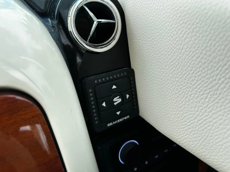 Slide: The Image of Control panel on 2023 Chris-Craft Launch 31 GT boat, featuring Seakeeper stabilizer. - 10