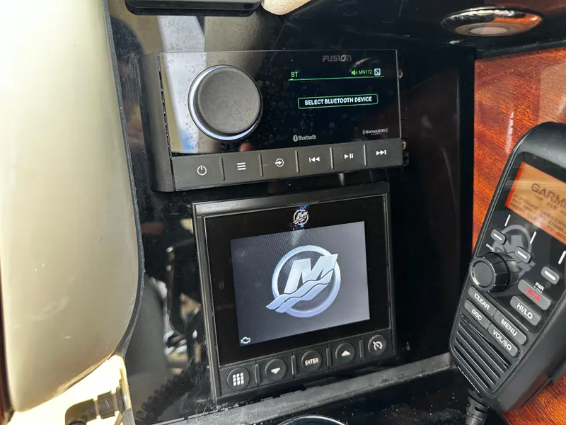 Slide: The Image of Control panel of 2023 Chris-Craft Launch 31 GT with audio and navigation systems. - 9