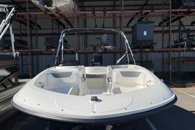 Slide: The Image of 2026 Bayliner Element E16 boat in storage, showcasing sleek design and spacious seating. - 5