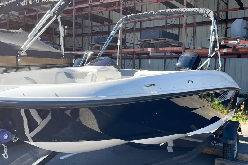 Slide: The Image of 2026 Bayliner Element E16 boat in storage, featuring sleek design and modern features. - 6