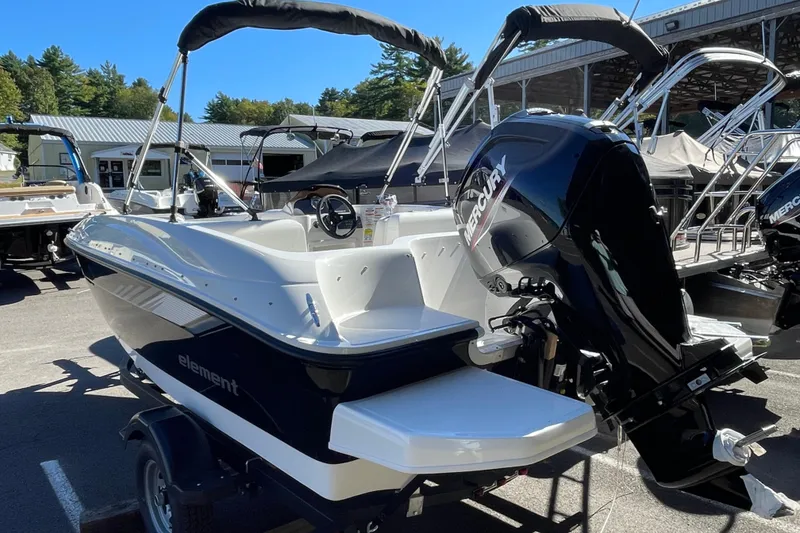 Slide: The Image of 2026 Bayliner Element E16 boat with Mercury engine, parked outdoors. - 8