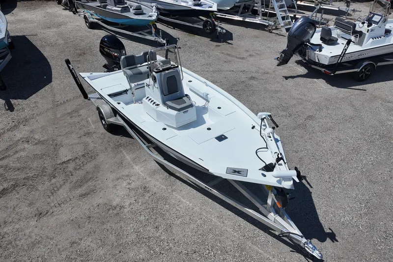 Slide: The Image of 2026 Xpress H20 boat on trailer in outdoor lot, featuring sleek design and modern equipment. - 5