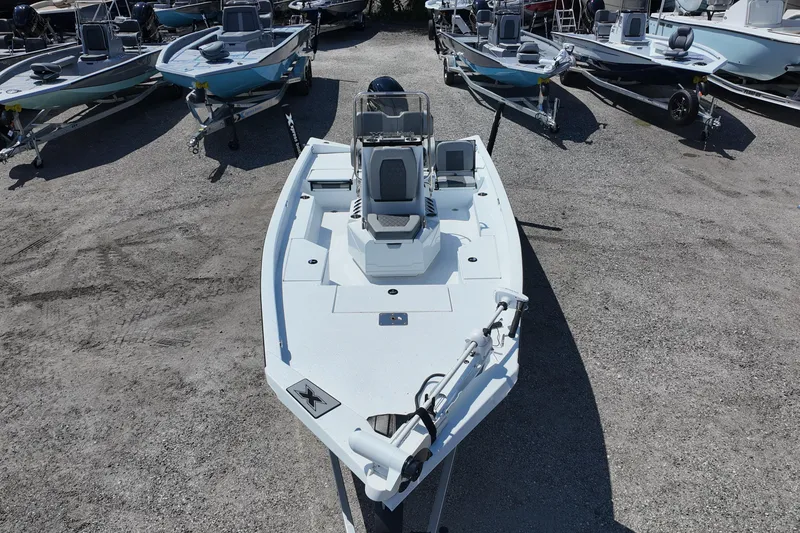 Slide: The Image of 2026 Xpress H20 boat displayed in a lot with other boats. - 6