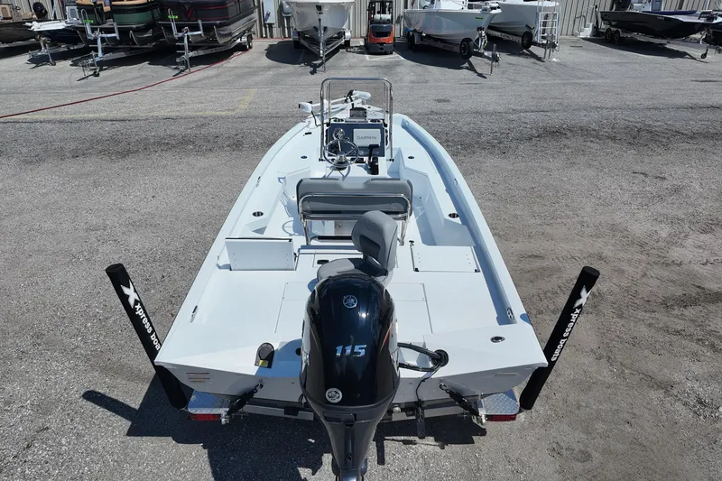 Slide: The Image of 2026 Xpress H20 boat with Yamaha 115 engine, parked in a marina. - 7