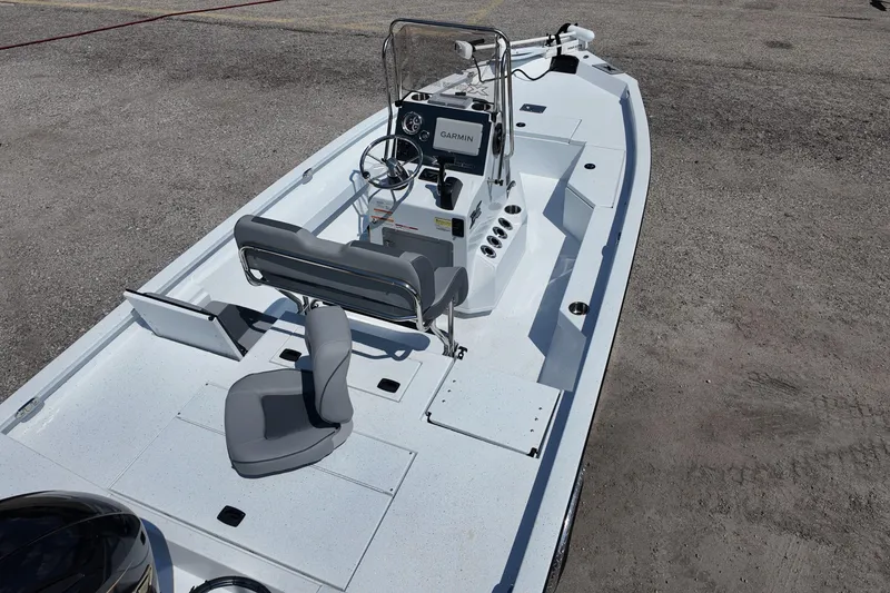 Slide: The Image of 2026 Xpress H20 boat with modern seating and navigation system on a concrete surface. - 8