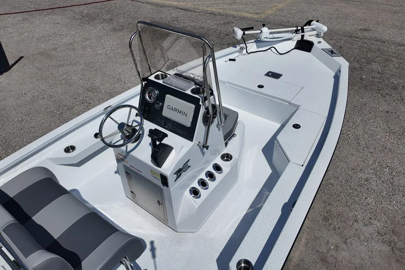 Slide: The Image of 2026 Xpress H20 boat interior with Garmin navigation system and steering console. - 9