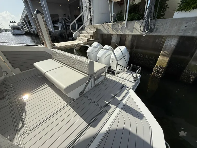 Slide: The Image of Schaefer 375 boat deck with seating and twin Mercury outboard engines, 2025 model. - 20