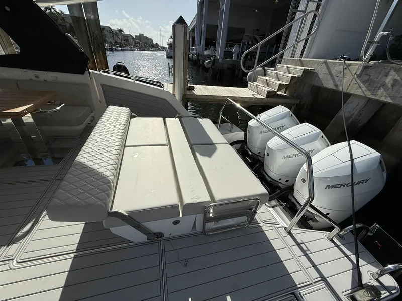 Slide: The Image of Luxury Schaefer 375 yacht with Mercury engines docked, featuring elegant seating. - 21