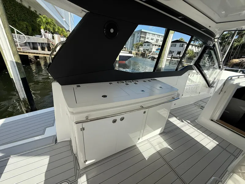 Slide: The Image of 2025 Schaefer 375 yacht interior with sleek cabinetry and waterfront view. - 22