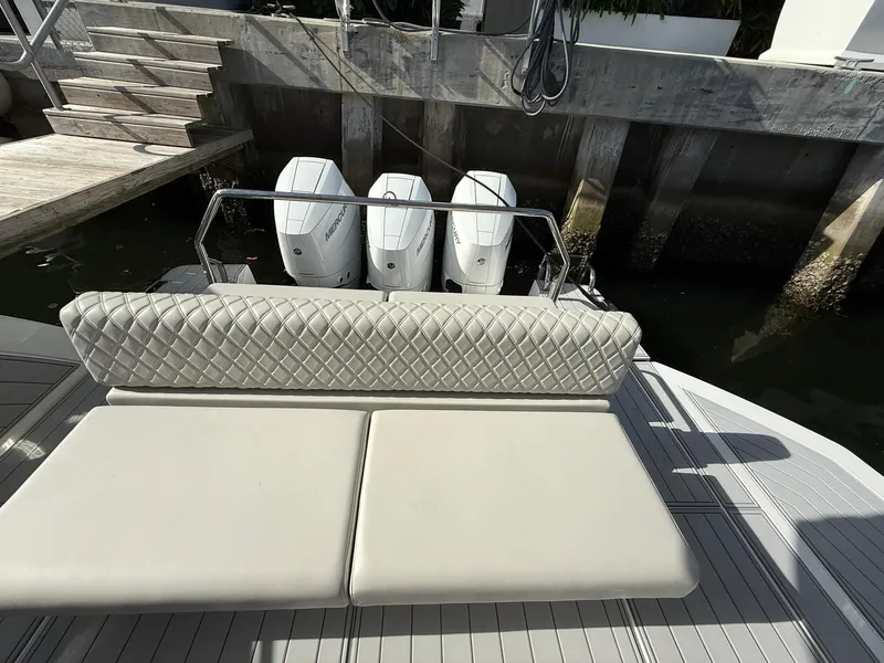 Slide: The Image of Luxury Schaefer 375 boat with triple Mercury engines, 2025 model, featuring elegant quilted seating. - 28