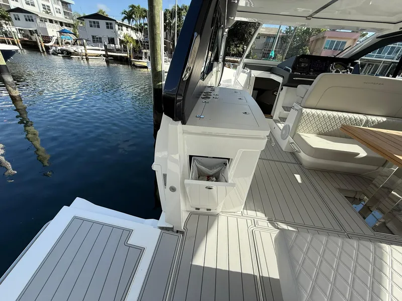 Slide: The Image of Luxurious 2025 Schaefer 375 yacht interior with elegant seating and modern amenities by the water. - 30