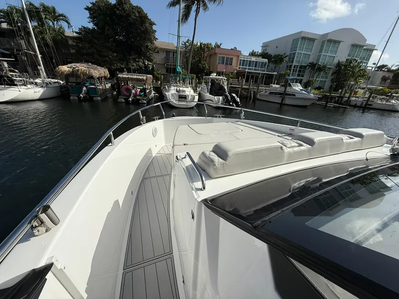 Slide: The Image of 2025 Schaefer 375 yacht docked in a marina, featuring sleek design and spacious deck. - 33