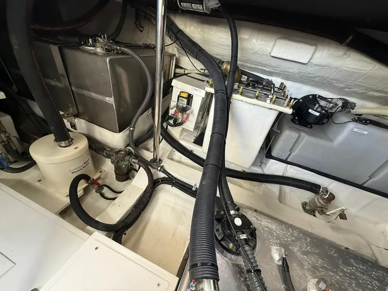 Slide: The Image of Engine compartment of 2025 Schaefer 375 yacht with visible wiring and components. - 37