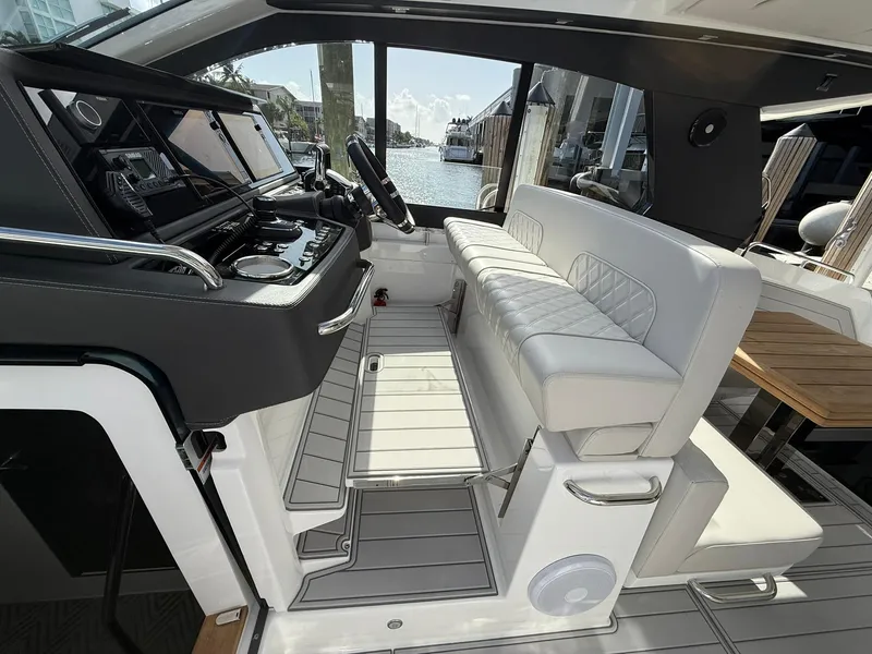 Slide: The Image of Luxury interior of 2025 Schaefer 375 yacht with modern helm and seating. - 45
