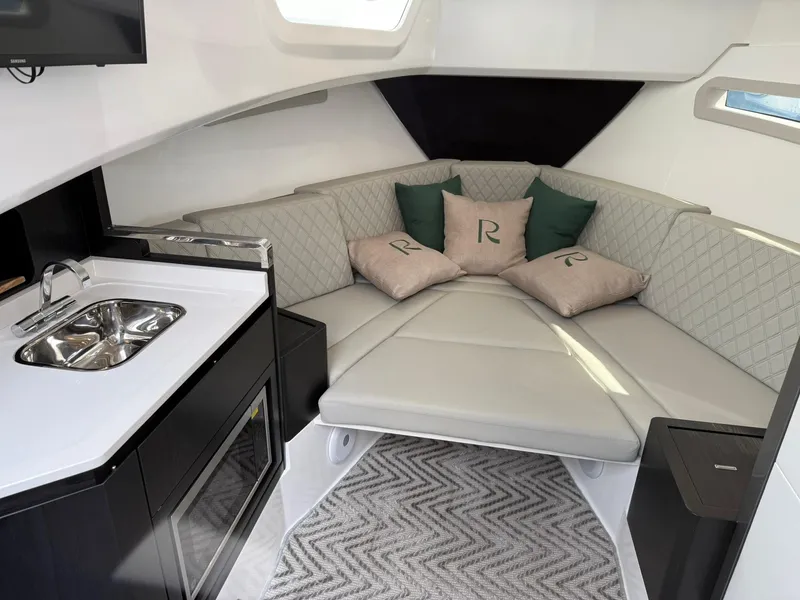 Slide: The Image of Luxurious interior of 2025 Schaefer 375 yacht with modern kitchenette and cozy seating area. - 48
