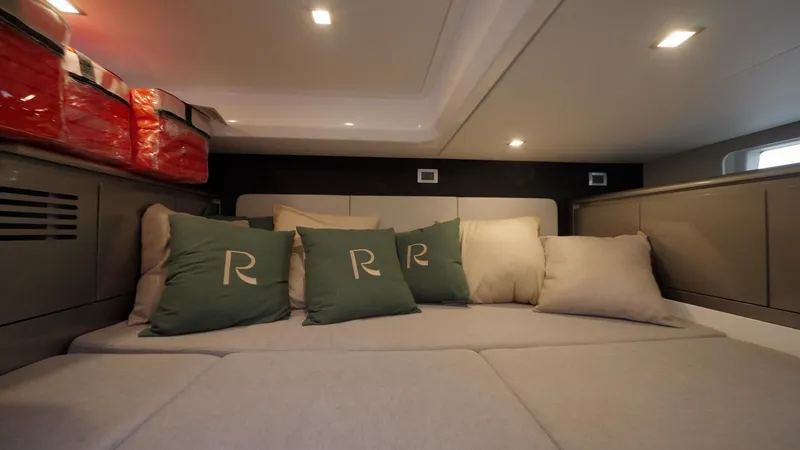 Slide: The Image of Luxurious interior cabin of 2025 Schaefer 375 yacht with cozy seating and cushions. - 49